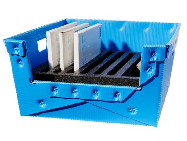 Blue corrugated plastic hopper front container, custom foam dunnage protects parts, reusable material handling box